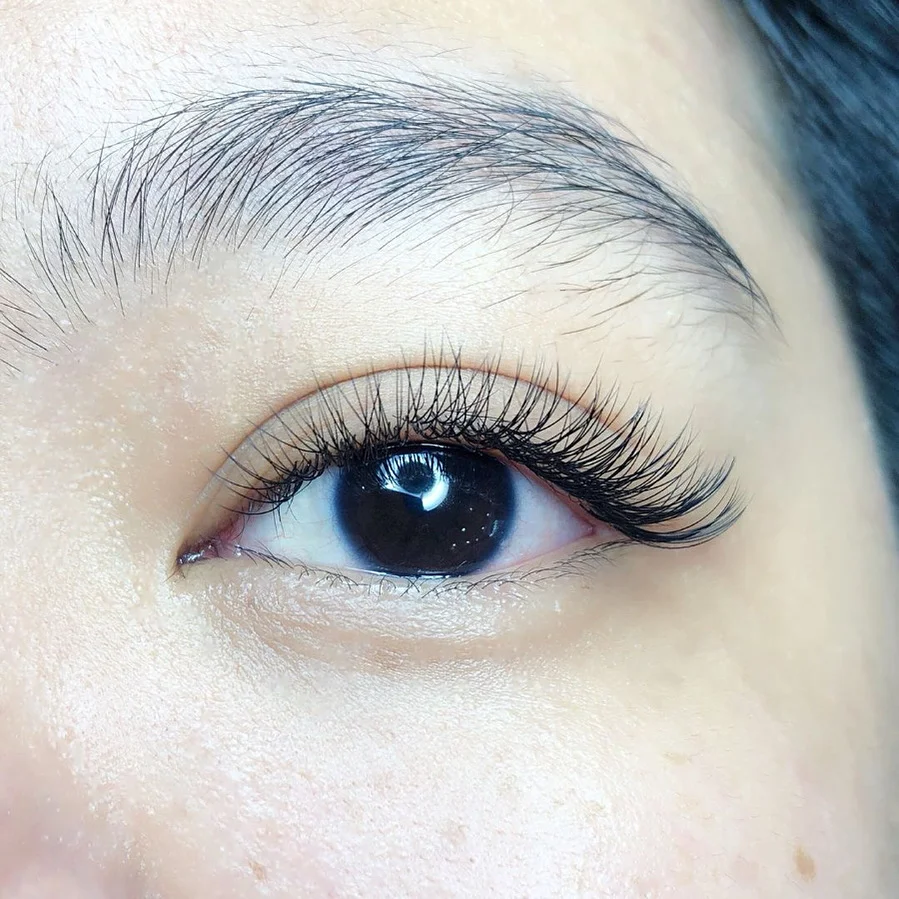 Eyebrow threading being performed with precision